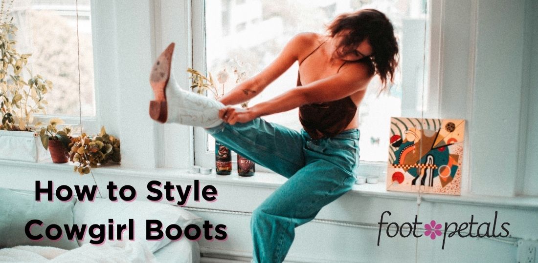 Woman sitting on windowsill, putting on white cowgirl boots