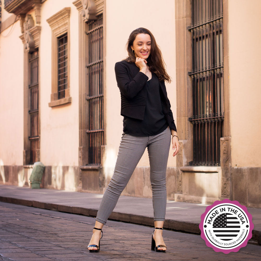 Woman standing on stone sidewalk while wearing black high heels with Foot Petals Ball of Foot Cushions inside #color_khaki